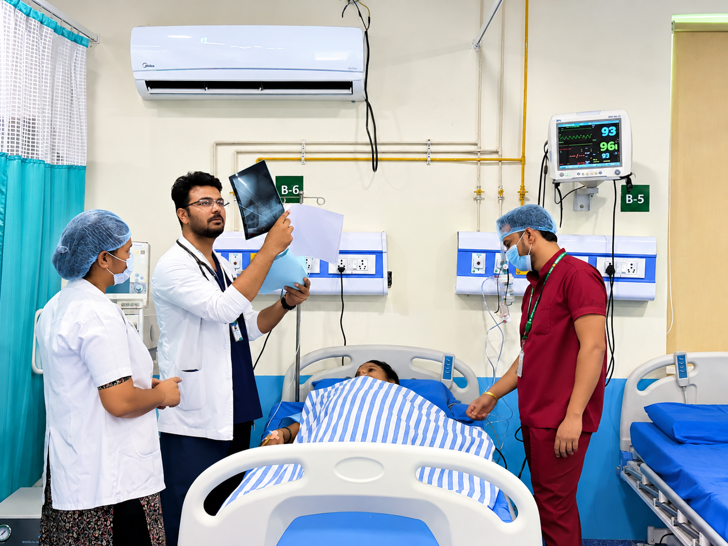 ICU care team at a patient's bedside